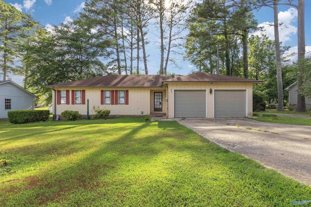 ranch-style home featuring a garage and a front yard