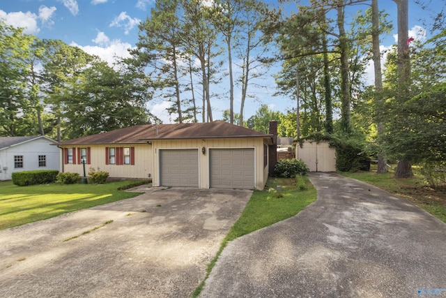 single story home with a garage and a front yard