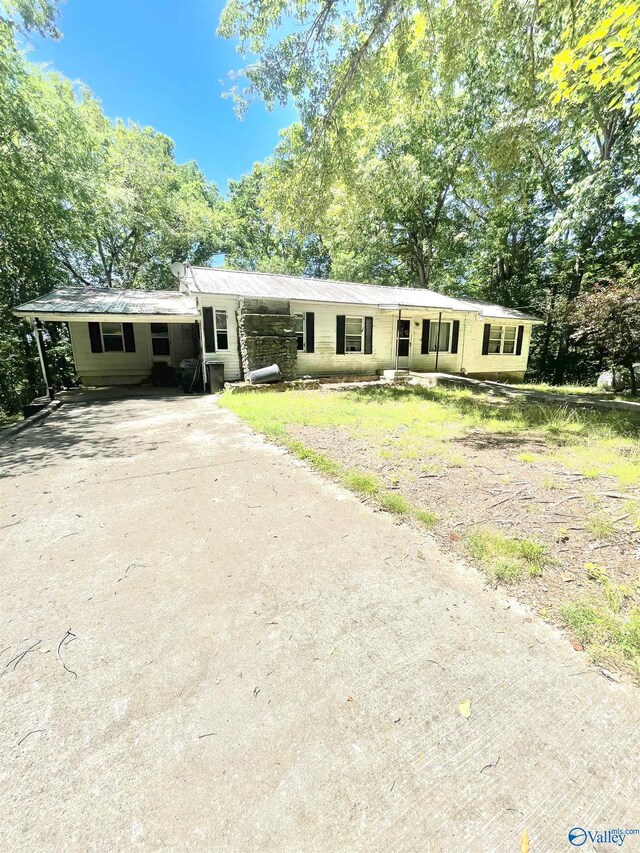 view of front of property with a carport