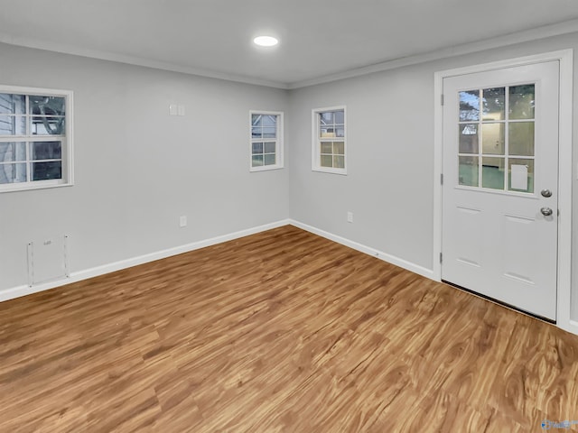 107 Patra Dr, Madison, AL 35758 - empty room featuring ornamental molding, plenty of natural light, and light wood-type flooring