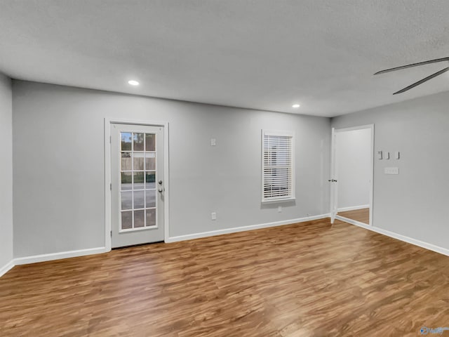 107 Patra Dr, Madison, AL 35758 - empty room with wood finished floors and recessed lighting
