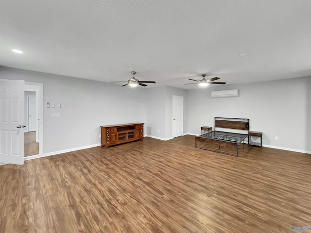 107 Patra Dr, Madison, AL 35758 - unfurnished living room featuring a wall mounted air conditioner, wood finished floors, ceiling fan, and recessed lighting