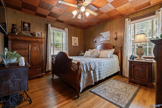 7250 County Road 113, Centre, AL 35960 - bedroom with wooden walls, light wood-style flooring, wood ceiling, and a ceiling fan