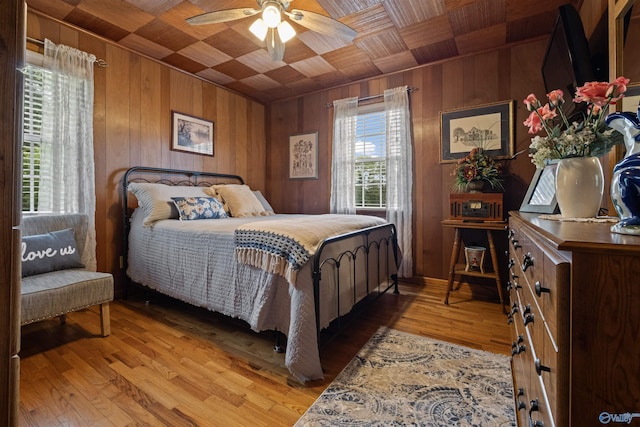 7250 County Road 113, Centre, AL 35960 - bedroom featuring wood walls, light wood-style flooring, and wood ceiling