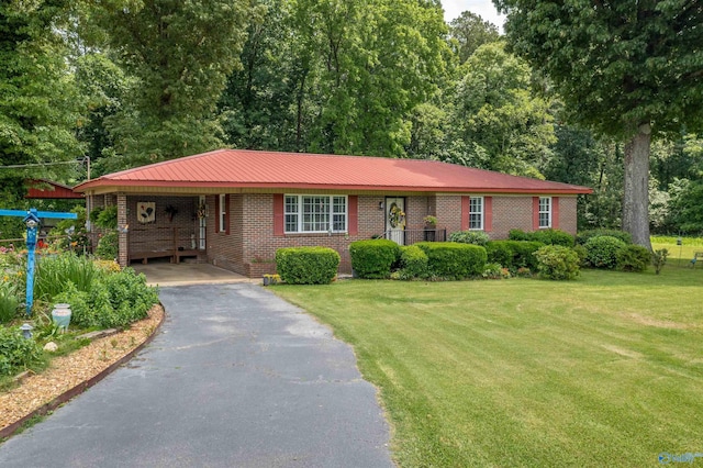 7250 County Road 113, Centre, AL 35960 - ranch-style home with driveway, a front lawn, an attached carport, brick siding, and metal roof