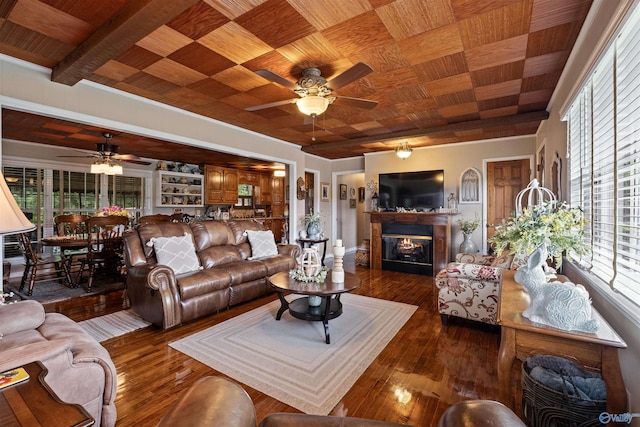 7250 County Road 113, Centre, AL 35960 - living area with wood ceiling, ceiling fan, a glass covered fireplace, and plenty of natural light