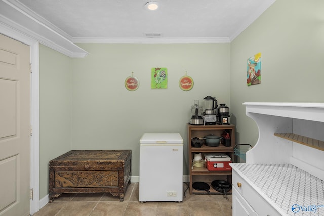 washroom featuring ornamental molding and light tile patterned floors