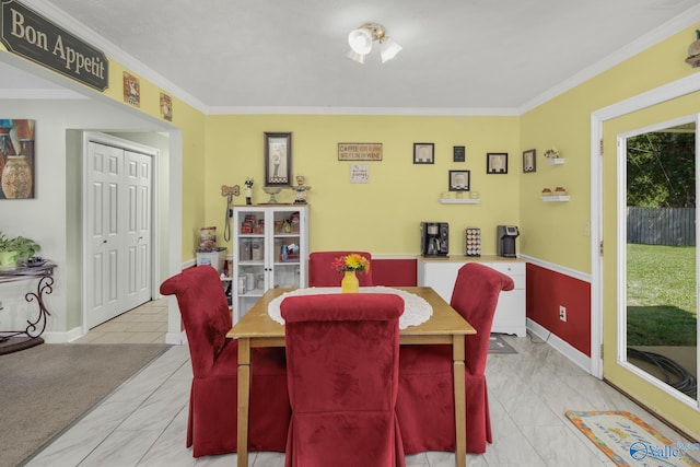 dining space featuring ornamental molding