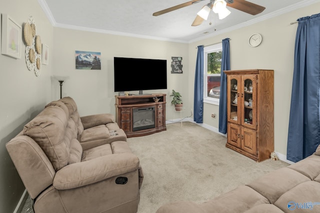 living room featuring a fireplace, ornamental molding, light carpet, and ceiling fan