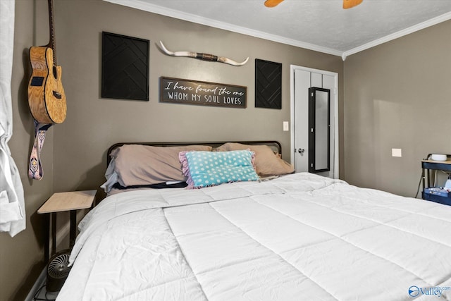 bedroom featuring a textured ceiling, ceiling fan, and ornamental molding