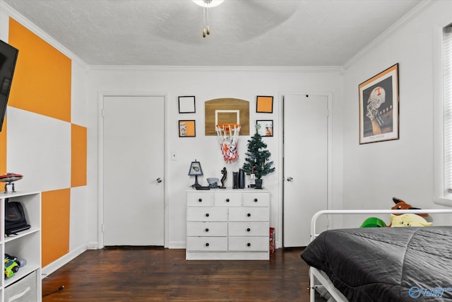 bedroom with a textured ceiling, dark hardwood / wood-style floors, ceiling fan, and ornamental molding