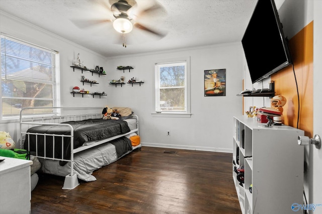 bedroom featuring multiple windows, ceiling fan, crown molding, and dark hardwood / wood-style floors