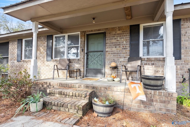 doorway to property with covered porch