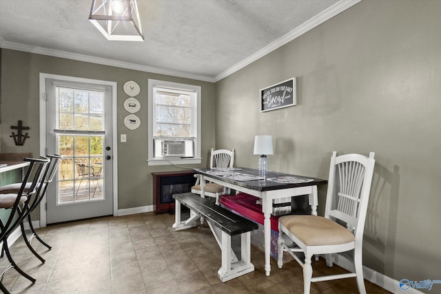 dining room featuring crown molding, cooling unit, and a textured ceiling