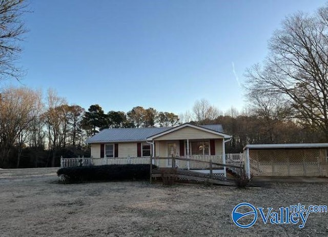 view of front of home featuring a carport