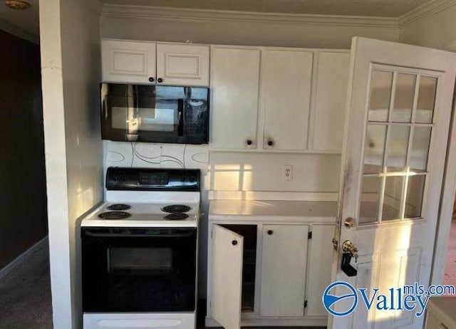 kitchen with white cabinetry, ornamental molding, and electric range oven