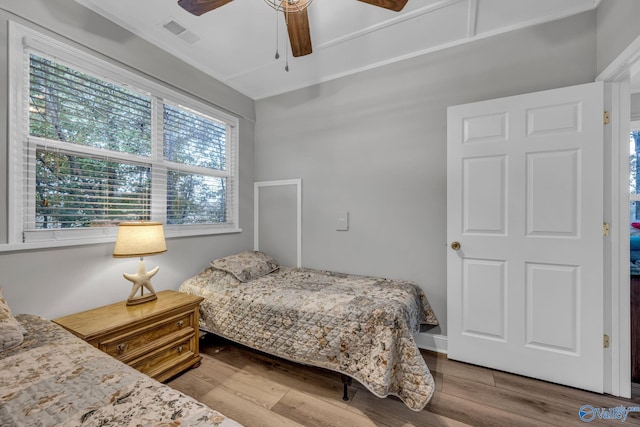 bedroom featuring wood-type flooring and ceiling fan