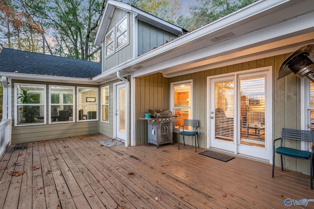 wooden terrace featuring grilling area