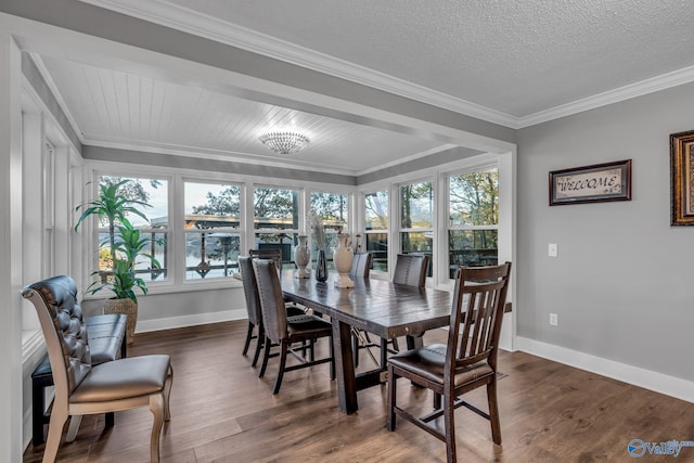 dining area with a textured ceiling, crown molding, a healthy amount of sunlight, and dark hardwood / wood-style floors