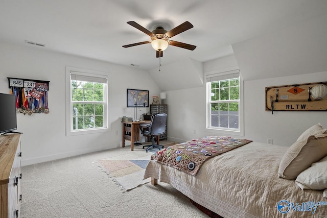 carpeted bedroom featuring baseboards, vaulted ceiling, a desk, and a ceiling fan