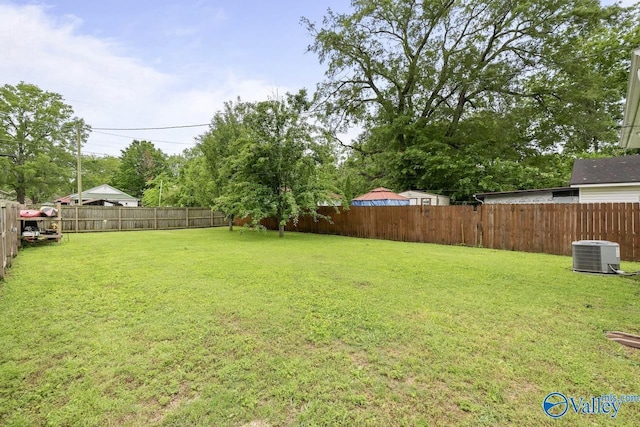 view of yard with central AC unit