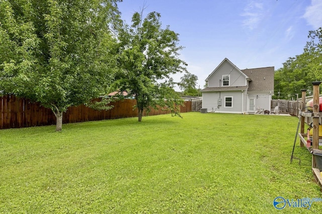 view of yard featuring central AC unit