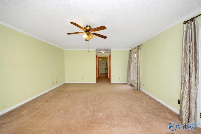 empty room featuring light carpet, baseboards, ornamental molding, and ceiling fan