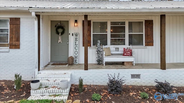 property entrance featuring covered porch