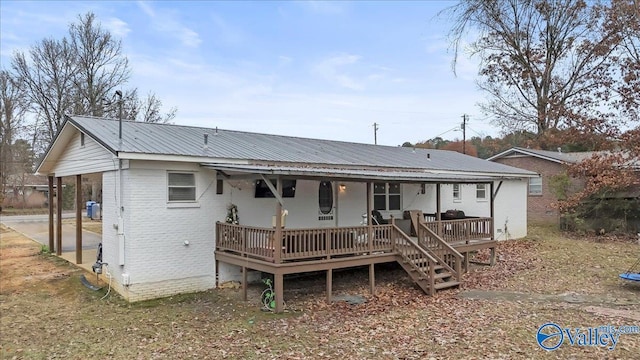 rear view of house with a deck