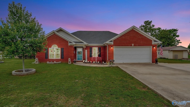 112 Bullard Rd, Hazel Green, AL 35750 - view of front of house featuring driveway, a lawn, a garage, and brick siding