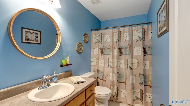 112 Bullard Rd, Hazel Green, AL 35750 - bathroom with toilet, vanity, and curtained shower