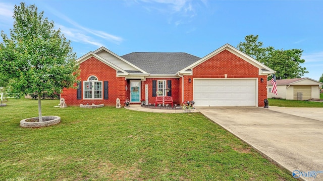 112 Bullard Rd, Hazel Green, AL 35750 - view of front facade with brick siding, driveway, an attached garage, a front yard, and a shingled roof