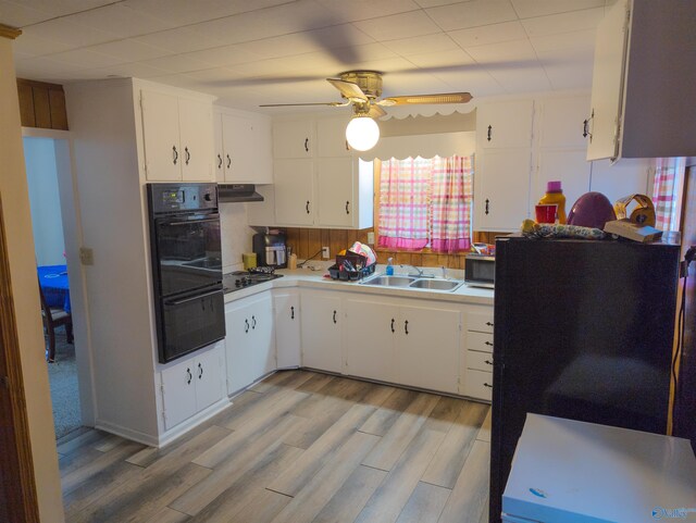 kitchen featuring black gas cooktop, white cabinetry, sink, ceiling fan, and light hardwood / wood-style flooring