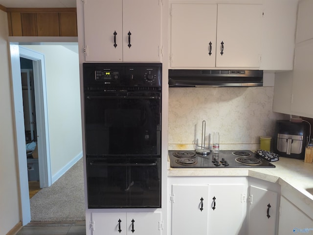 kitchen featuring white cabinets