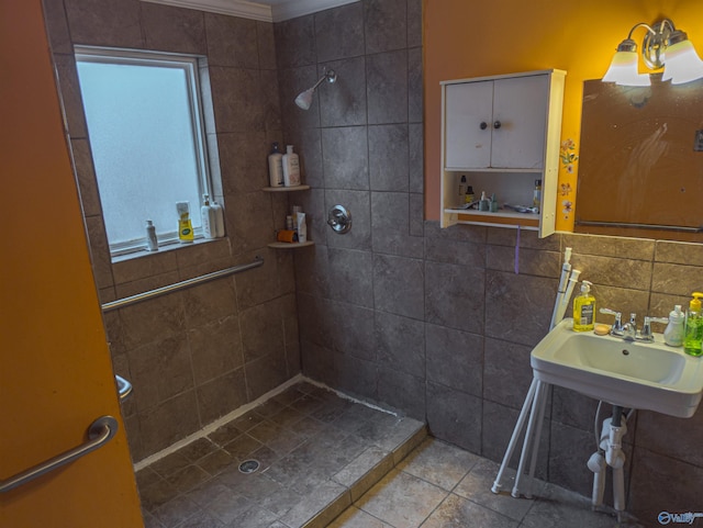 bathroom featuring decorative backsplash, sink, tile walls, and a tile shower