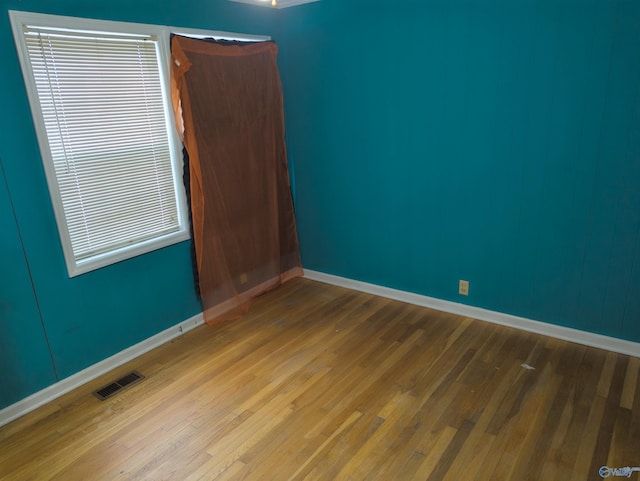 spare room featuring hardwood / wood-style floors