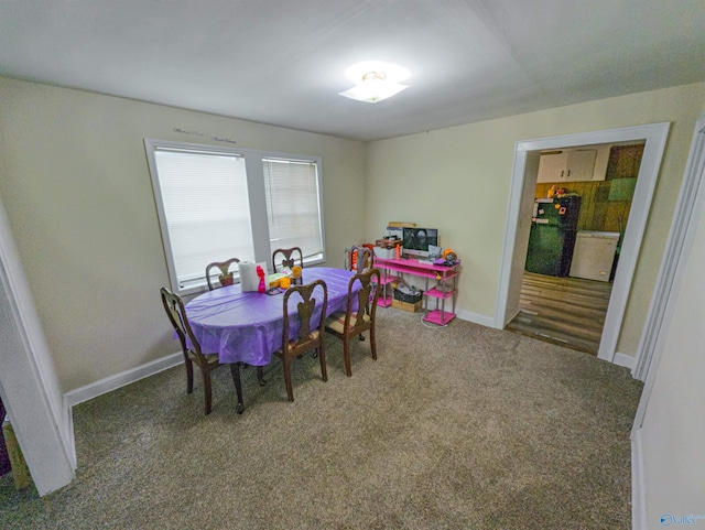 dining space featuring carpet flooring