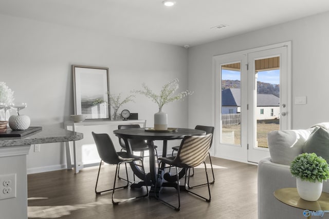 dining area with dark wood-type flooring