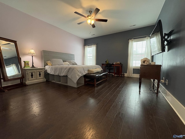 bedroom with dark wood-type flooring and ceiling fan