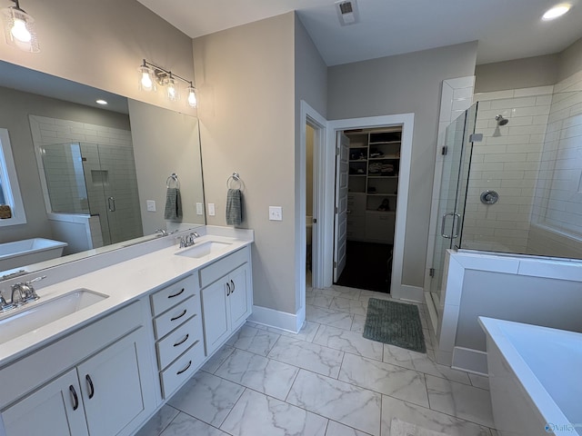 bathroom with vanity and an enclosed shower