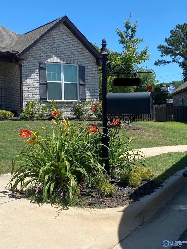 view of side of home featuring a lawn