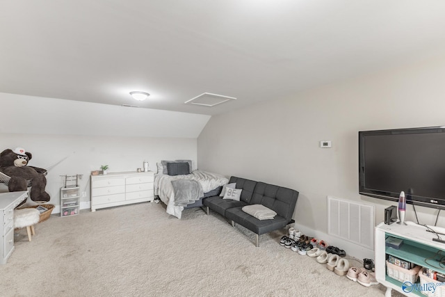 carpeted bedroom with vaulted ceiling