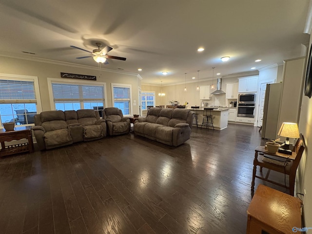 living room featuring ornamental molding and dark hardwood / wood-style floors