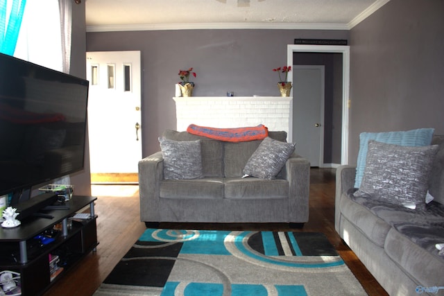 living room with hardwood / wood-style flooring and ornamental molding