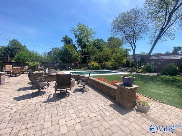 view of patio / terrace featuring a fenced backyard and a fenced in pool