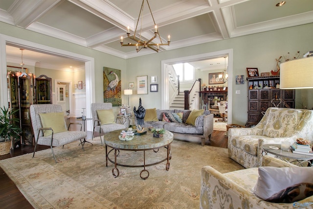 living area with stairs, wood finished floors, coffered ceiling, and an inviting chandelier