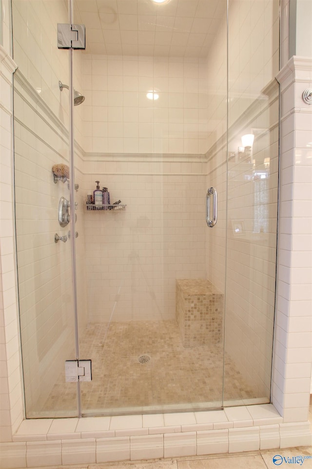 full bath featuring a shower stall