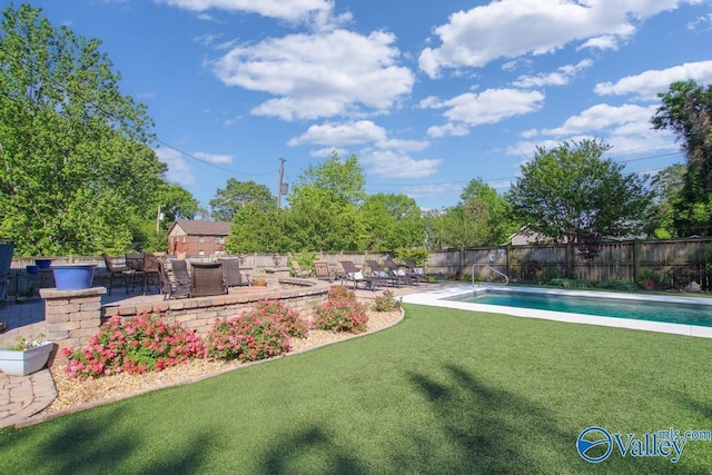 view of yard with a fenced in pool, a patio, and fence