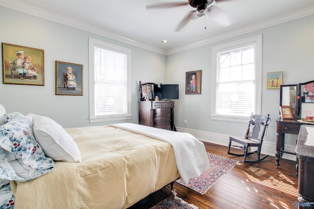 bedroom featuring a ceiling fan, crown molding, baseboards, and hardwood / wood-style flooring