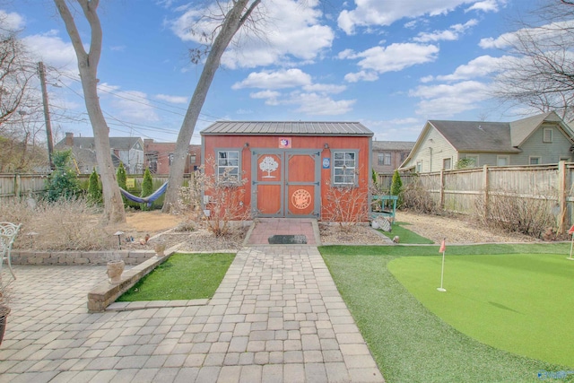 view of shed with a fenced backyard